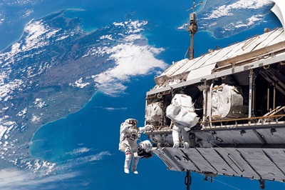 Astronauts participate in extravehicular activity