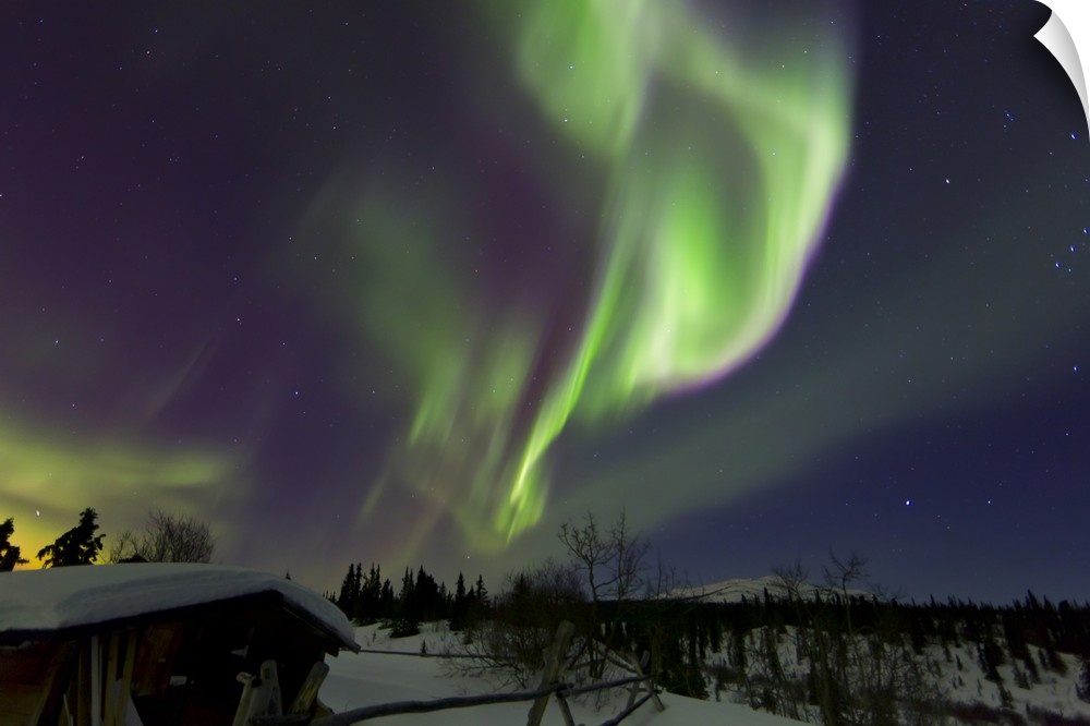 Aurora borealis above a cabin at Fish Lake, Whitehorse, Yukon, Canada.