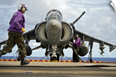 Aviation Boatswain's Mates Refuel An AV-8B Harrier Jet Aircraft