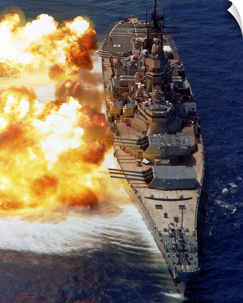 Battleship USS Iowa firing its Mark 7 16-inch/50-caliber guns.