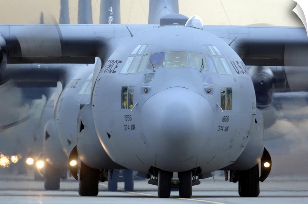 Yokota Air Base, Japan - C-130 Hercules aircraft taxi out for a mission during a six-ship sortie.