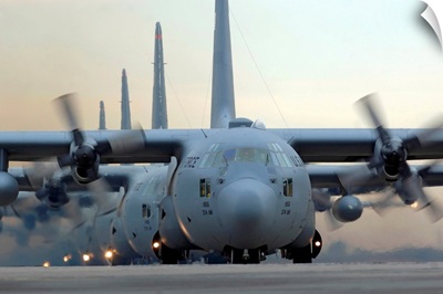 C130 Hercules aircraft taxi out for a mission during a sixship sortie