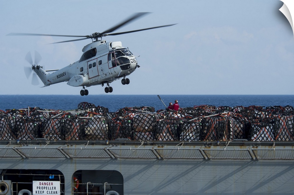 Andaman Sea, January 14, 2015 - An AS-332 Super Puma helicopter attached to dry cargo and ammunition ship USNS Carl Brashe...