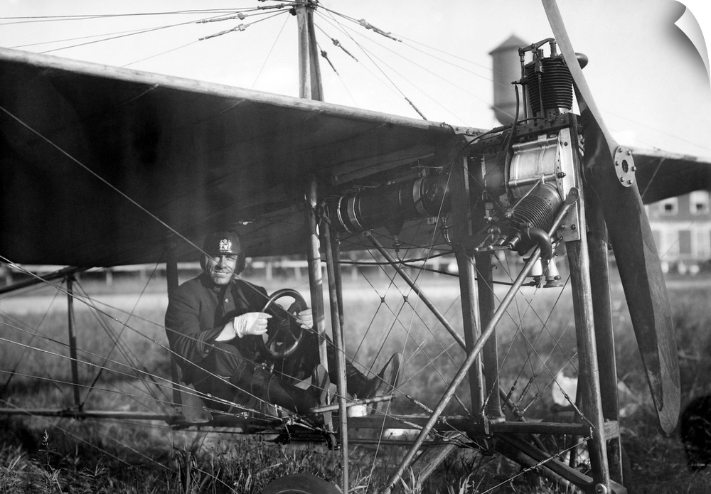 Charles Murphy, aka Mile-a-Minute Murphy, seated in a monoplane. Murphy was a policeman who championed the use of airplane...