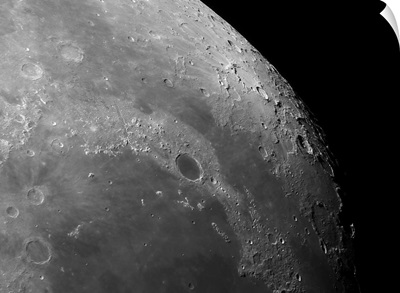 Close up view of the moon showing impact crater Plato