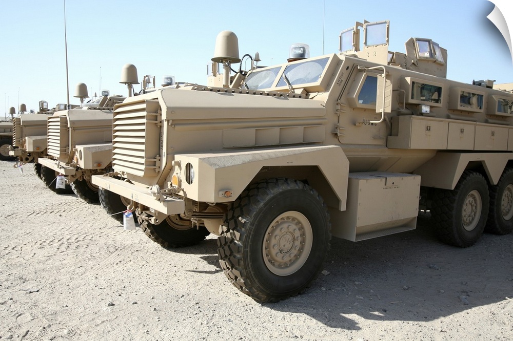 Al Taqaddum, Iraq, September 11, 2007 - Mine Resistant Ambush Protected vehicles await transportation to units throughout ...