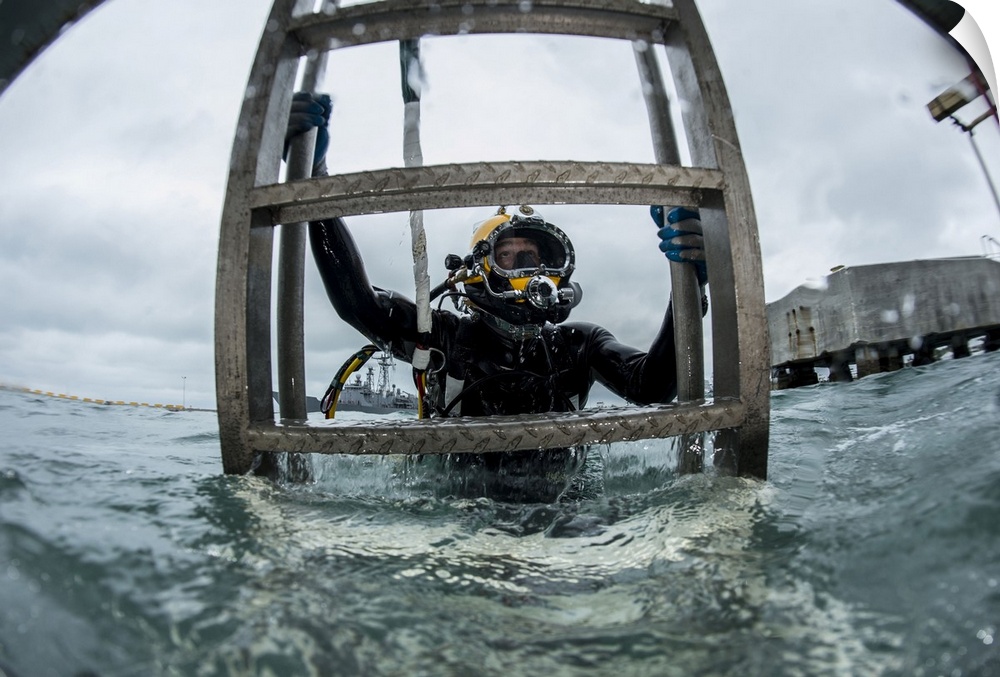 Key West, Florida, January 16, 2015 - Diver from Underwater Construction Team One (UCT ONE), ascends a ladder after comple...