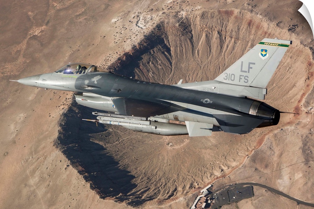 F-16C Fighting Falcon flying above Arizona's Meteor Crater. The F-16C Fighting Falcon is the flagship of the 310th Fighter...