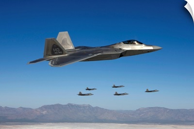 F-22 Raptors fly in formation during a training mission over New Mexico