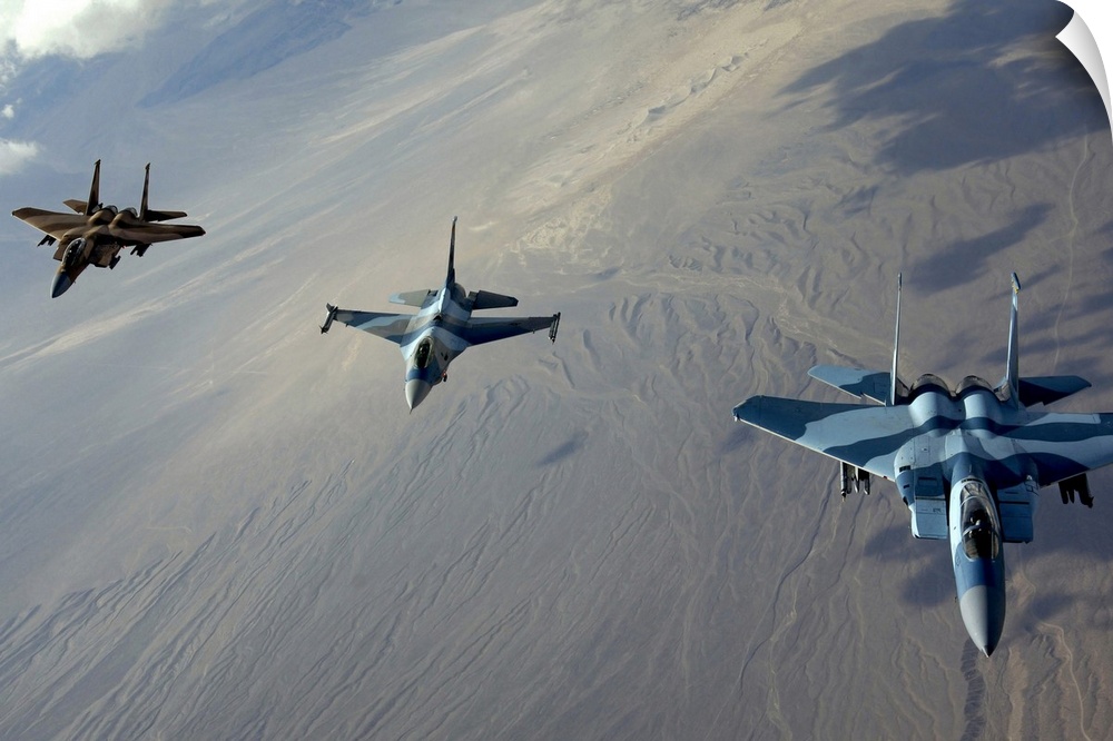 Big photo on canvas of three fighter jets flying in a diagonal line formation above a desert.