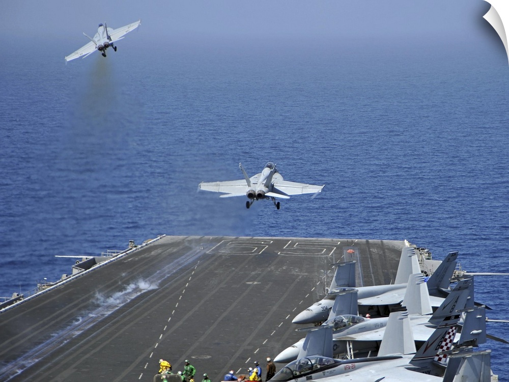 Red Sea, March 17, 2011 - F/A-18F Super Hornets launch from the aircraft carrier USS Enterprise (CVN-65). Enterprise is on...