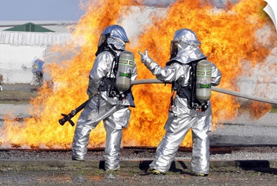 Firefighters Battle A Simulated Fire