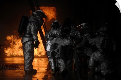 Firefighters Extinguish A Simulated Cargo Fire At RAF Mildenhall, England