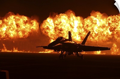 Flames Explode Behind An F/A-18 Hornet Of The U.S. Navy Blue Angels