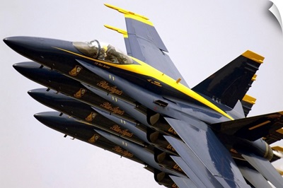 Four Blue Angels F/A18C Hornets perform the Echelon Parade maneuver