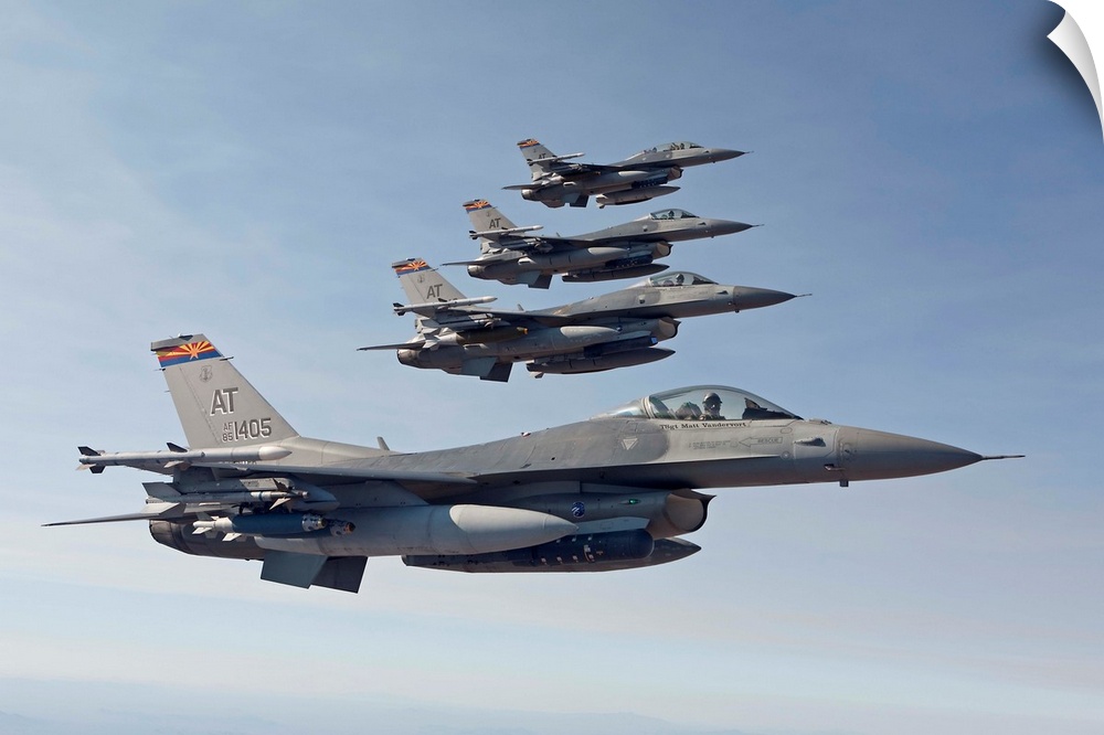 Four F-16's from the Air National Guard Air Force Reserve Test Center fly in formation during a test mission out of the Tu...