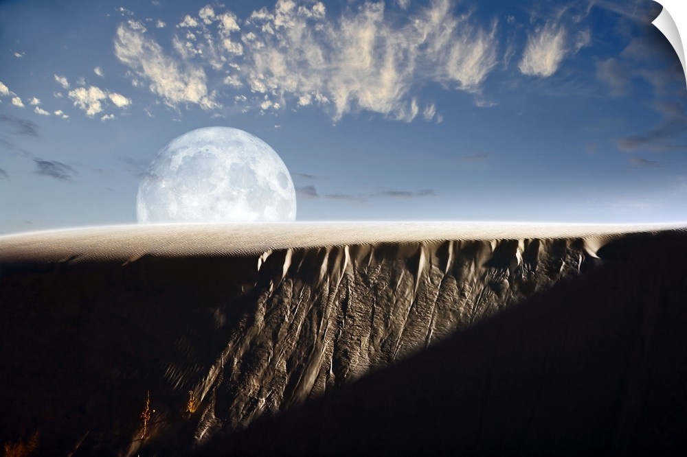 Full moon rising above a sand dune.