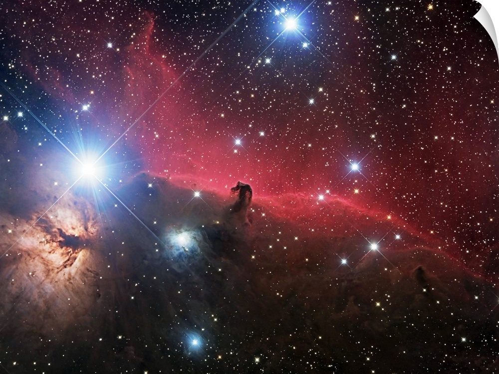 Space photograph of glowing clouds of nebulae in the Orion constellation system with a multitude of shining stars.