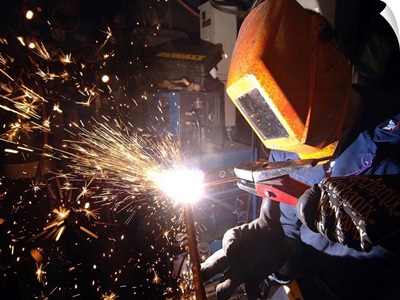 Hull Technician practices cutting metal using a Carbon arc