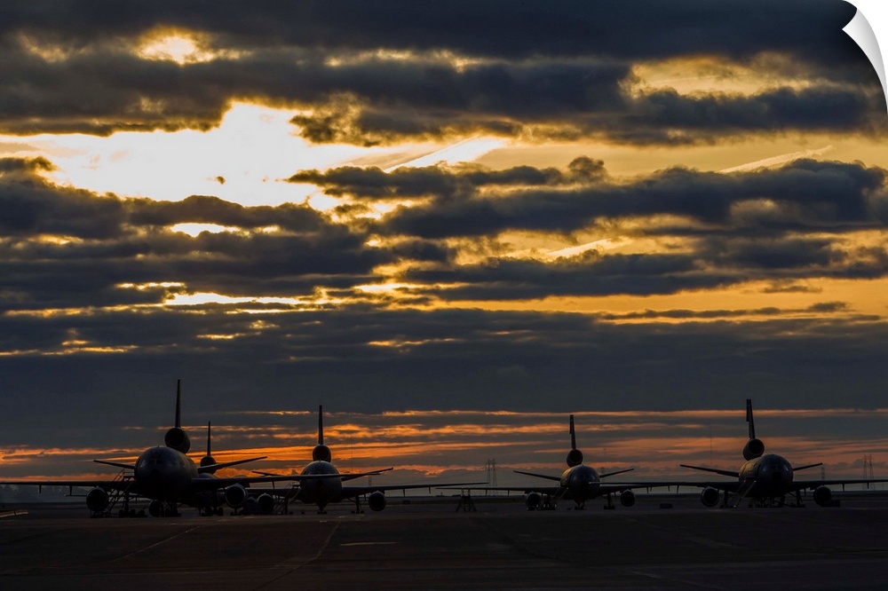 KC-10 Extenders of the U.S. Air Force sit on the ramp at Travis Air Force Base, California, at sunrise.
