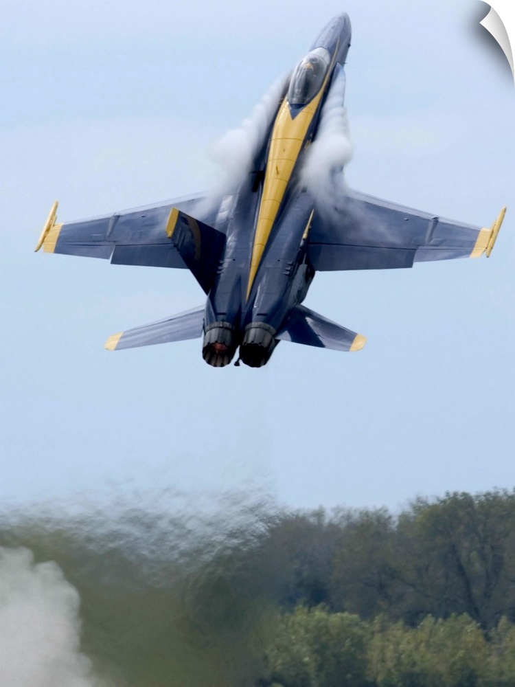 Lead solo pilot of the Blue Angels performs a high performance climb