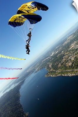 Members of the US Navy Parachute Team the Leap Frogs perform a biplane