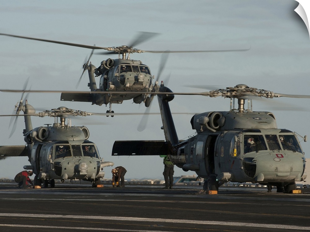 Pacific Ocean, December 21, 2011 - SH-60F and HH-60H Sea Hawk helicopters land on the flight deck aboard the Nimitz-class ...