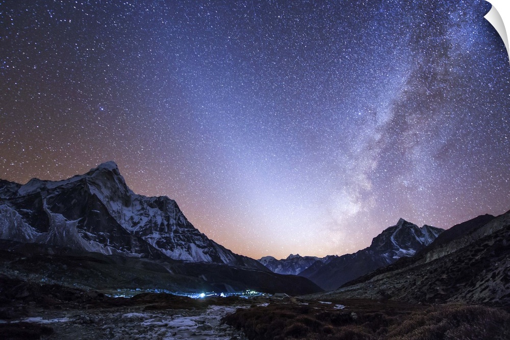 Milky way vs. zodiacal light, a celestial V was captured after sunset over the Himalayas in eastern Nepal. The Sherpa's mo...