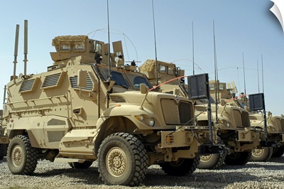 Mine Resistant Ambush Protected vehicles sit in parking area at Joint Base Balad Iraq