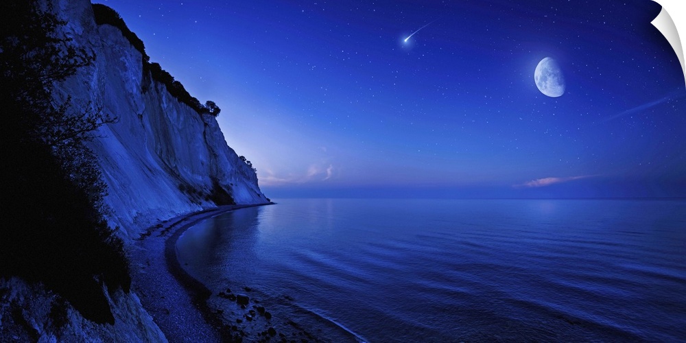 Moon rising over tranquil sea and Mons Klint cliffs against starry sky with falling meteorite, Denmark.