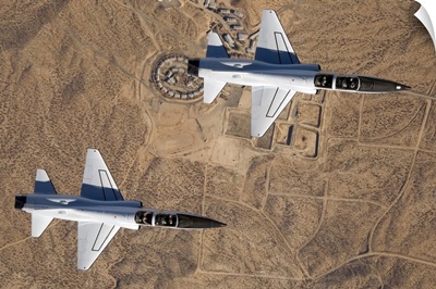 NASA Drydens two T38A mission support aircraft fly in tight formation