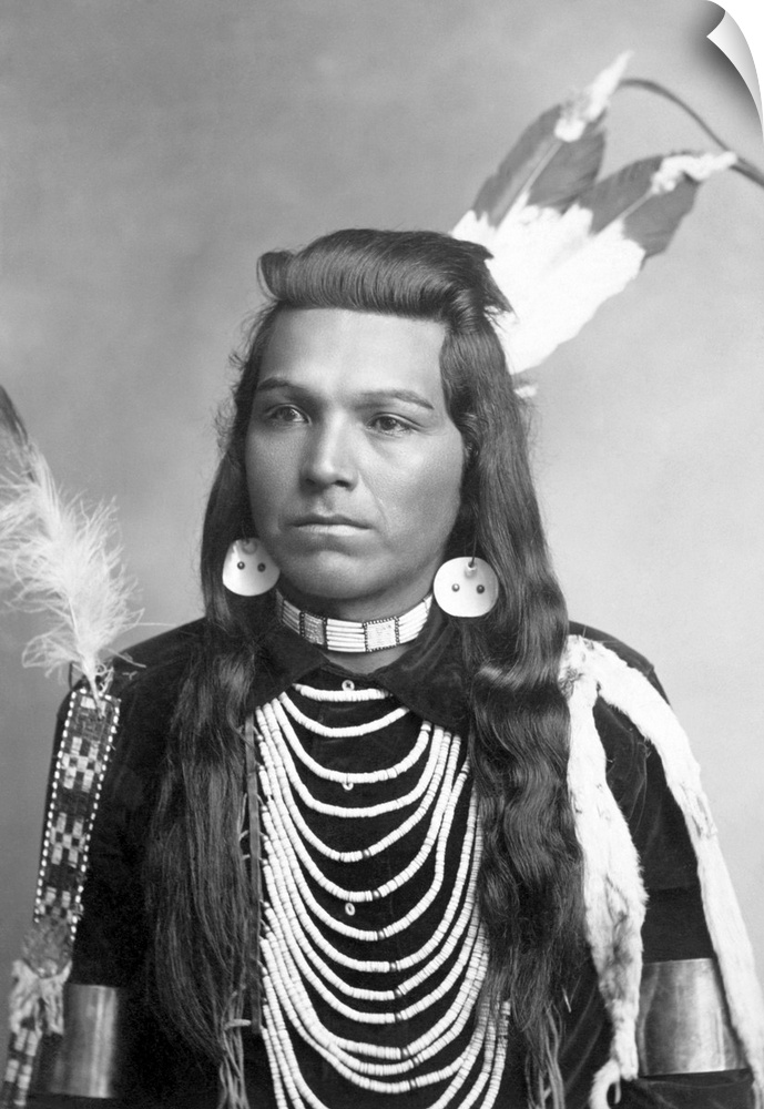 Native American portrait of Joseph Cregg, a man from the Plateau region, wearing necklaces.