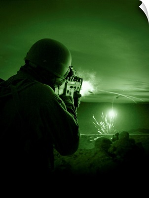 Night vision view of a special operations forces soldier firing his weapon during combat