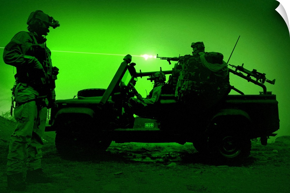Night vision view of U.S. Special Forces on patrol in a special operation vehicle.