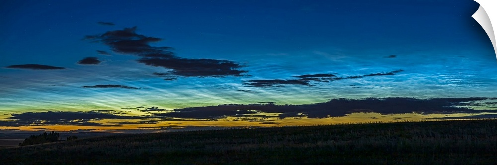 A 45 degree panorama of noctilucent clouds seen the night of June 1-2, 2020 in Alberta, Canada, first at dusk and then lat...