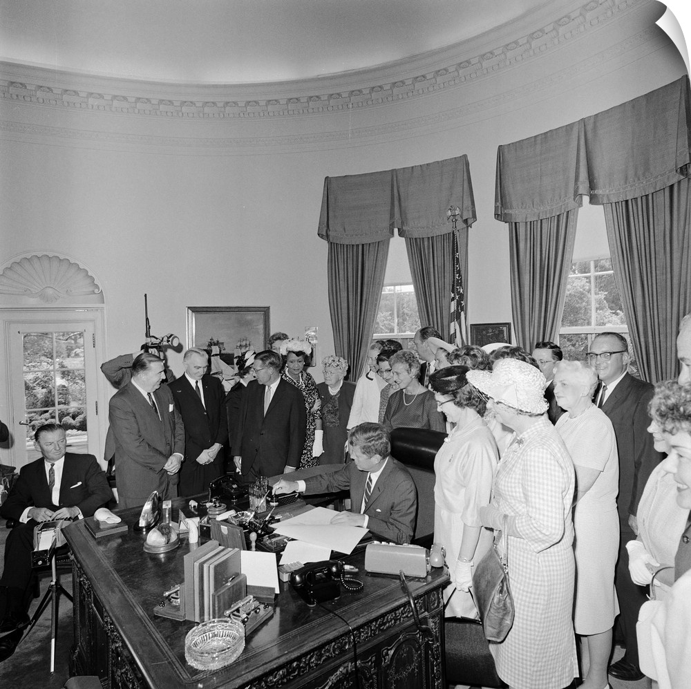 President John F. Kennedy signing the Equal Pay Act.