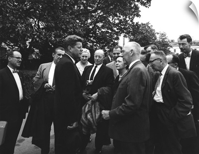President John F. Kennedy visits with reporters