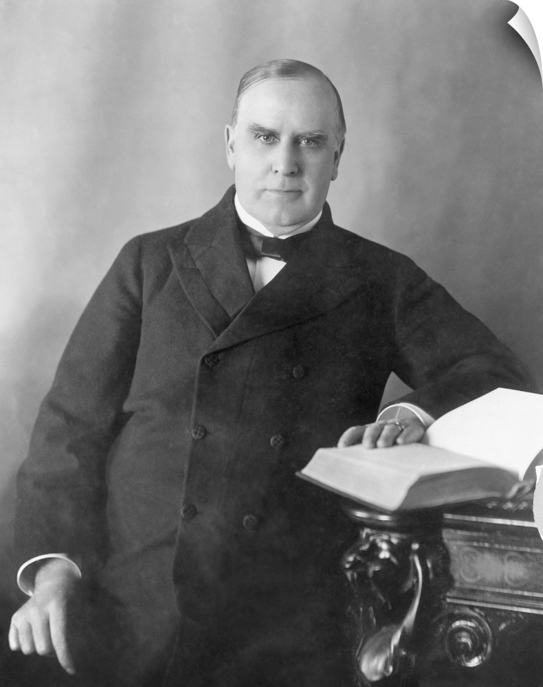 President William McKinley seated at desk, circa 1900.