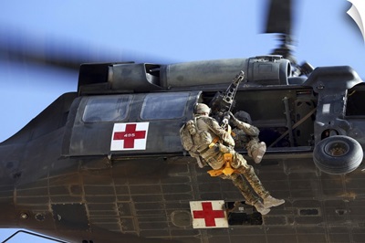Royal Australian Air Force Aircraftman Is Hoisted Onto A UH-60 Black Hawk