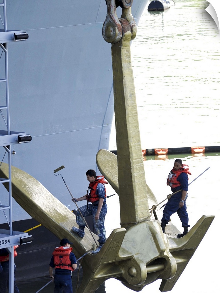 Everett, Washington, June 6, 2012 - Sailors paint the starboard anchor of the aircraft carrier USS Nimitz gold in preparat...