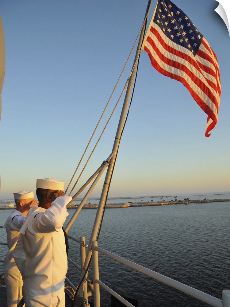 Naval Station Mayport, Florida, November 3, 2012 - Sailors salute the national ensign during colors aboard the multipurpos...