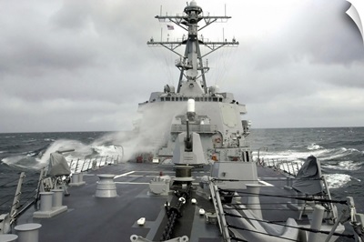 Sea spray whips across the deck of the USS Winston S Churchill