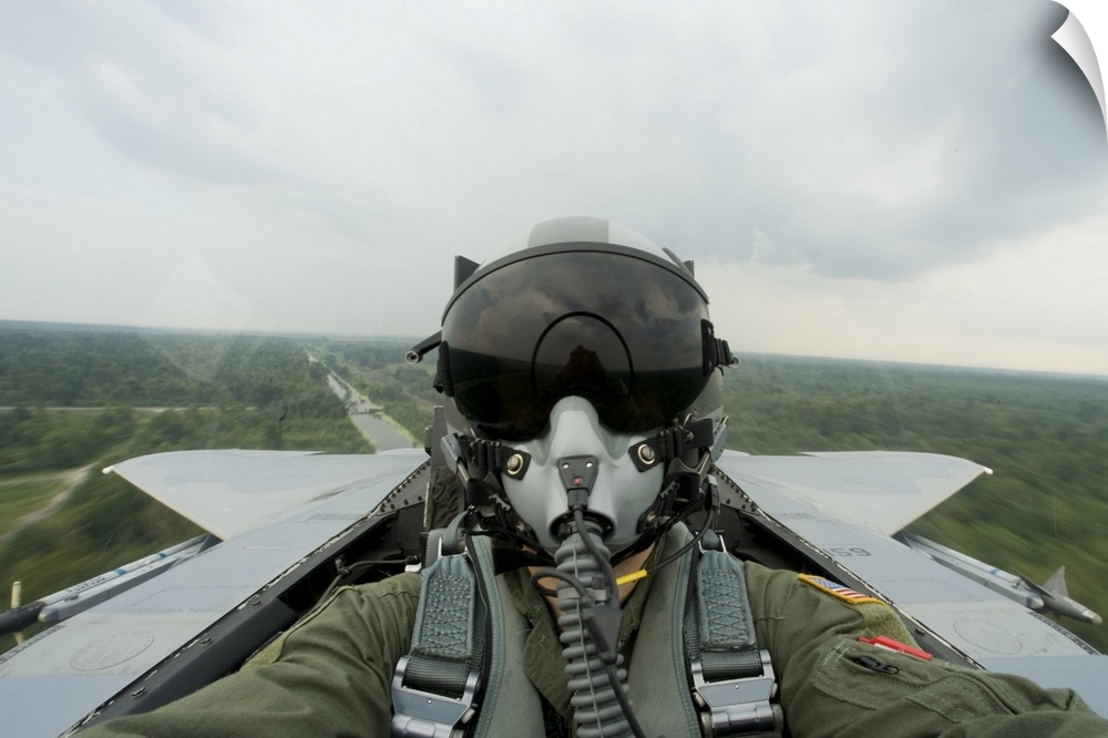August 27, 2008 - An aerial combat photographer takes a self-portrait during a sortie over New Orleans, Louisiana.