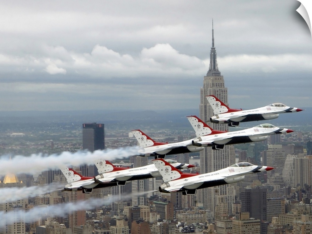 Photo of six US Air Force Thunderbirds flying in V formation high above New York City with the Empire State Building in th...