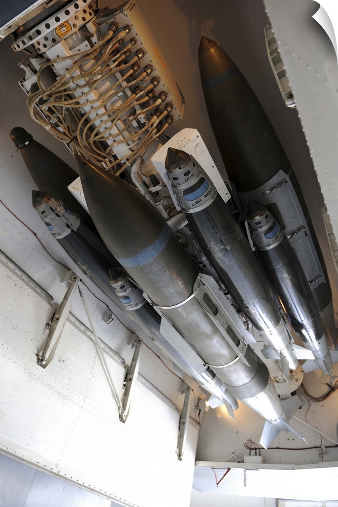March 31, 2011 - An assortment of 500-pound and 2,000-pound joint direct attack munitions are connected to a multiple ejec...