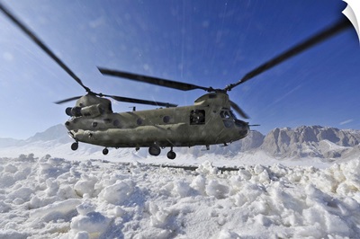Snow Flies Up As A US Army CH-47 Chinook Helicopter Prepares To Land