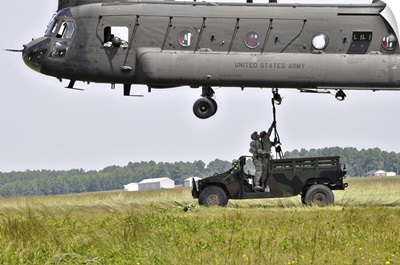 Soldiers Teach Students Sling Load Operations On A CH-47 Chinook