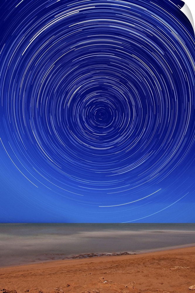 Star trails around the south celestial pole at the beach in Miramar, Argentina. Note the lack of a polar star as there is ...