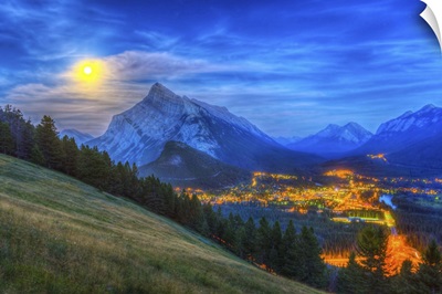 Supermoon rising over Mount Rundle and Banff townsite in Canada