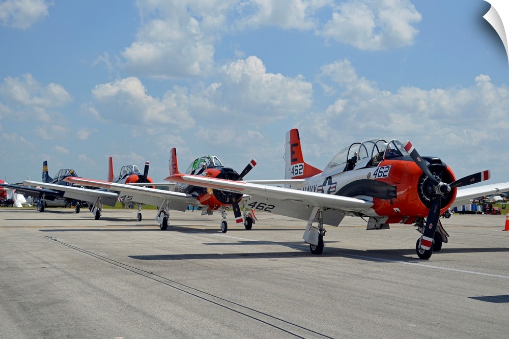 T-28C Trojan aircraft lined up on the flight line after a successful aerobatic showing.